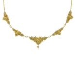 An early 20th century 18ct gold floral necklace, with seed pearl drop.