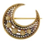 A late Victorian 18ct gold openwork crescent brooch.