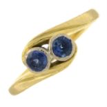 An 18ct gold sapphire two-stone ring.