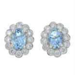 A pair of 18ct gold aquamarine and diamond cluster earrings.