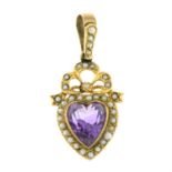 An early 20th century gold amethyst and seed pearl heart pendant.