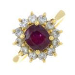 A ruby and brilliant-cut diamond cluster ring.