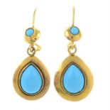 A pair of reconstituted turquoise earrings.
