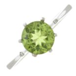 A peridot and diamond single-stone ring.