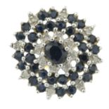 A sapphire and single-cut diamond cluster ring.