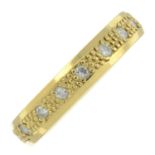 An 18ct gold diamond band ring.