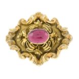 A late 19th century gold garnet brooch.