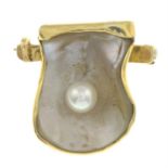 A cultured pearl and mother-of-pearl stylised scallop shell brooch.