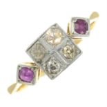 An early 20th century 18ct gold and platinum circular-cut diamond and ruby dress ring. AF.