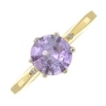 An 18ct gold purple sapphire and diamond dress ring.