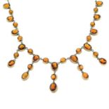 An early 20th century gilt metal citrine necklace.