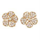A pair of 18ct gold diamond stud earrings of flowers.