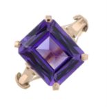 A synthetic colour change sapphire dress ring, with inner sizing aid.