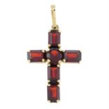 A garnet cross pendant.