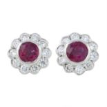 A pair of 18ct gold ruby and diamond cluster earrings.