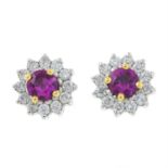 A pair of 18ct gold ruby and diamond cluster earrings.