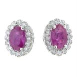 A pair of 18ct gold ruby and diamond stud earrings.