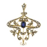 An early 20th century 9ct gold sapphire and split pearl pendant. AF.