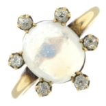 An early 20th century gold moonstone cabochon and diamond cluster ring.