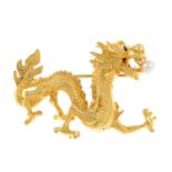 A ruby and cultured pearl dragon brooch.