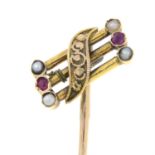 An early 20th century 15ct and 9ct gold split pearl and ruby stickpin.