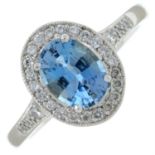 A platinum aquamarine and diamond cluster ring.