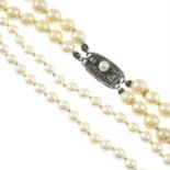 A two-strand and a single-stand cultured pearl necklace.