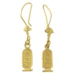 A pair of Egyptian 18ct gold drop earrings featuring lotus flowers and hieroglyphs.
