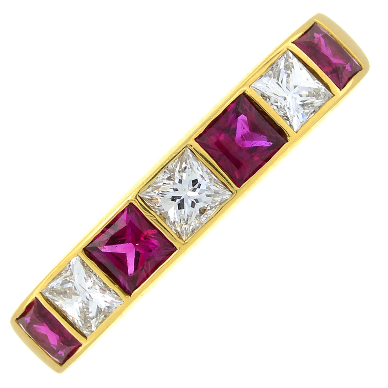 An 18ct gold ruby and diamond band ring.