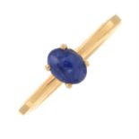 A sapphire cabochon single-stone ring.