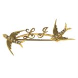 An early 20th century 15ct gold split pearl swallow bird initial bar brooch.