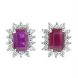 A pair of ruby and diamond cluster earrings.