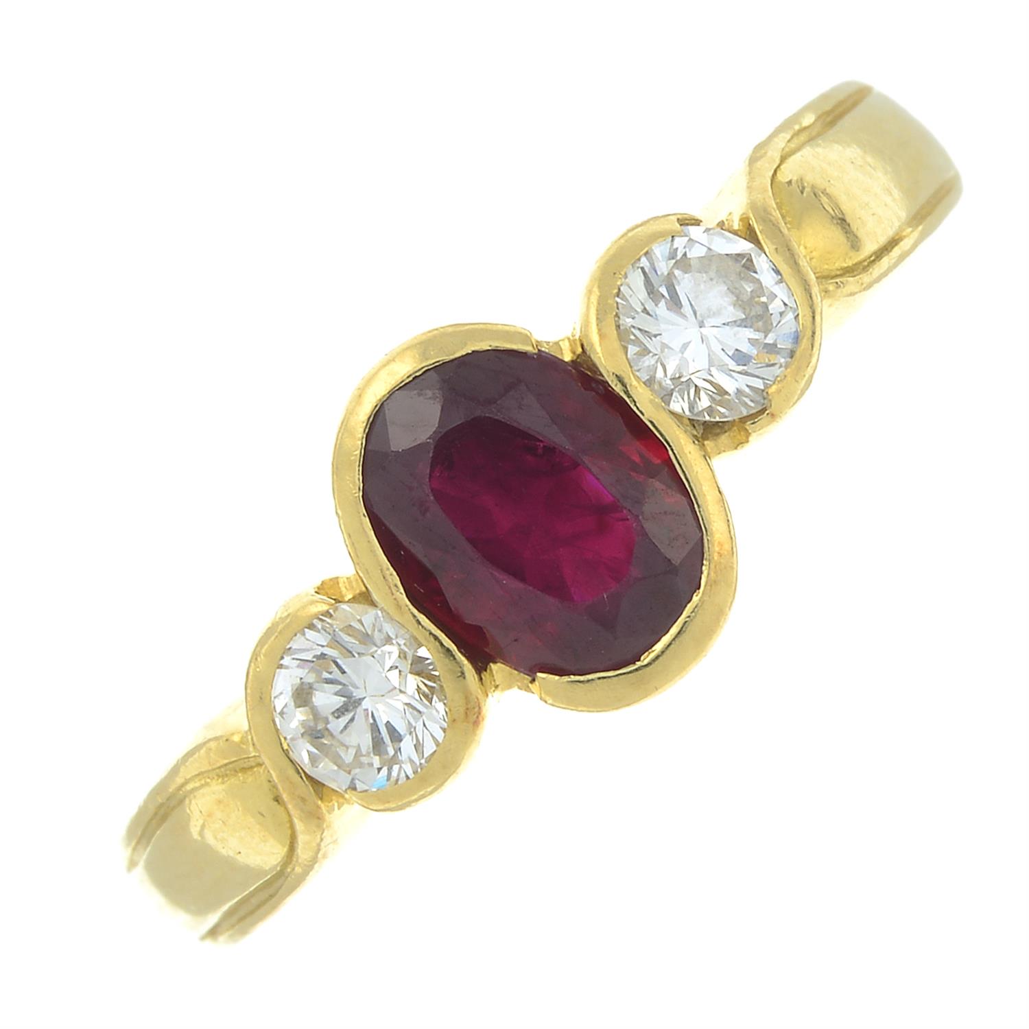 An 18ct gold ruby and diamond three-stone ring.