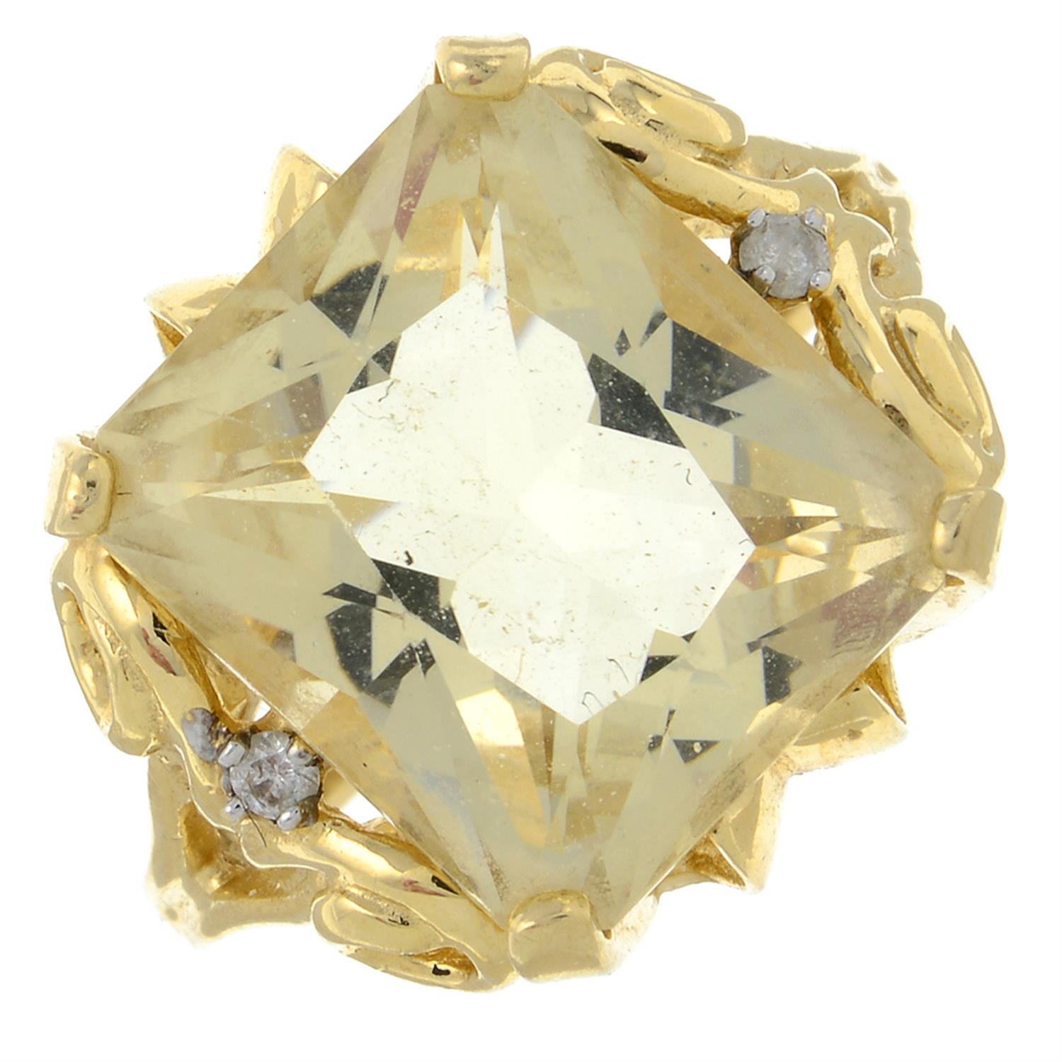 A citrine and diamond dress ring.