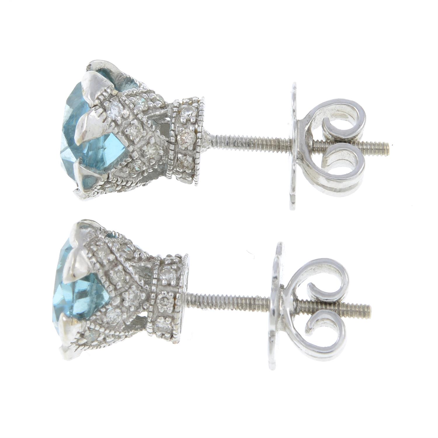 A pair of blue zircon and diamond stud earrings. - Image 2 of 2