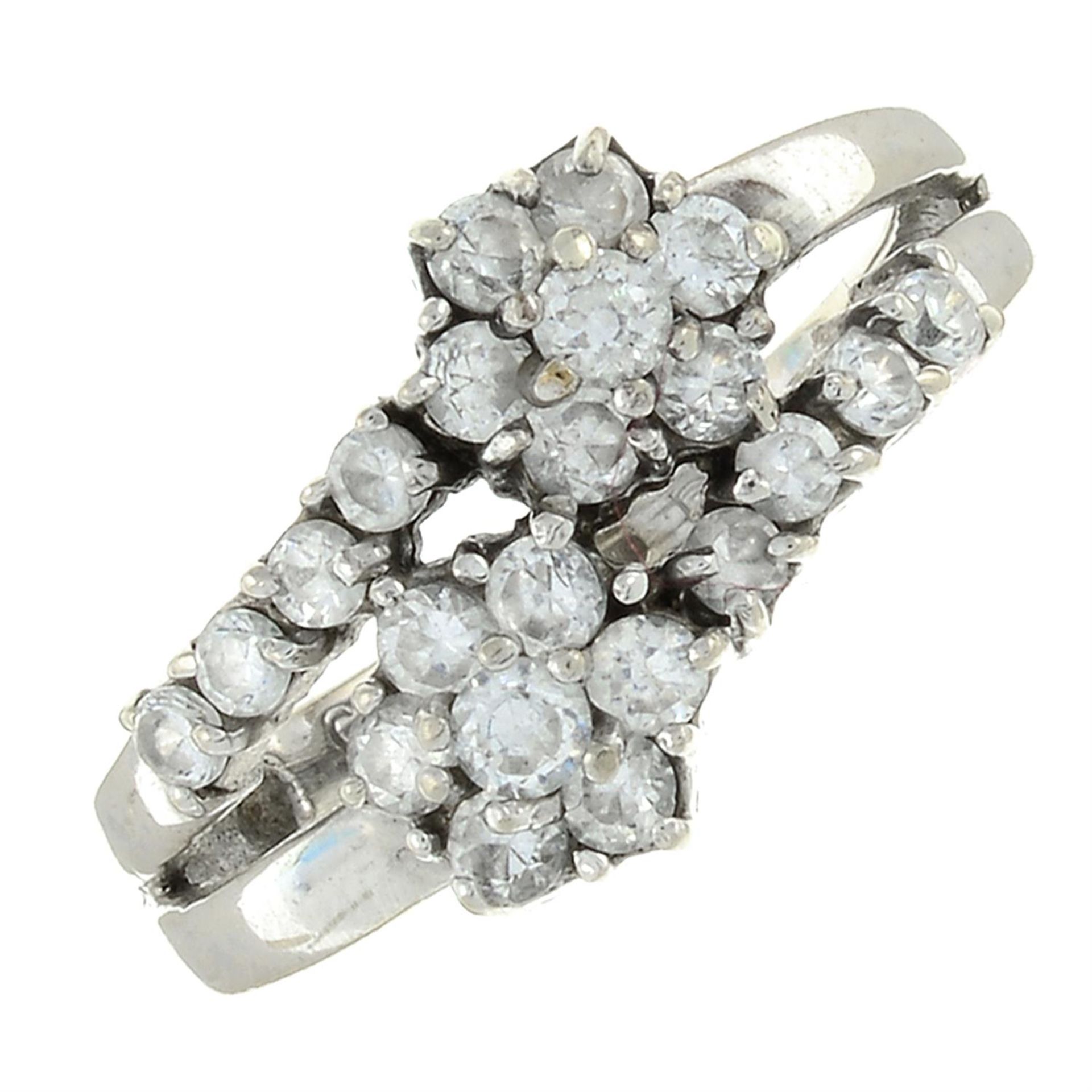 A 9ct gold cubic zirconia cluster crossover ring.