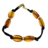 An amber cord bracelet.