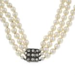 (26911) A cultured pearl three-row necklace, with diamond push-piece clasp.