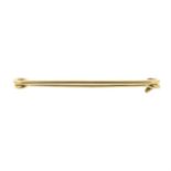 A 9ct gold safety pin.