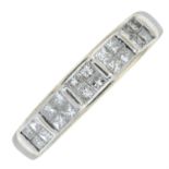 A diamond half eternity ring.