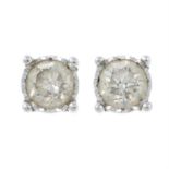 (26636) A pair of illusion-set diamond single-stone earrings.