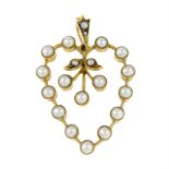 An early 20th century gold split pearl heart pendant.