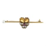 An early 20th century gold diamond and gem-set brooch.