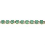 A 9ct gold emerald and diamond line bracelet.