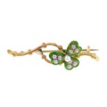 An early 20th century 15ct gold split pearl and enamel shamrock brooch.