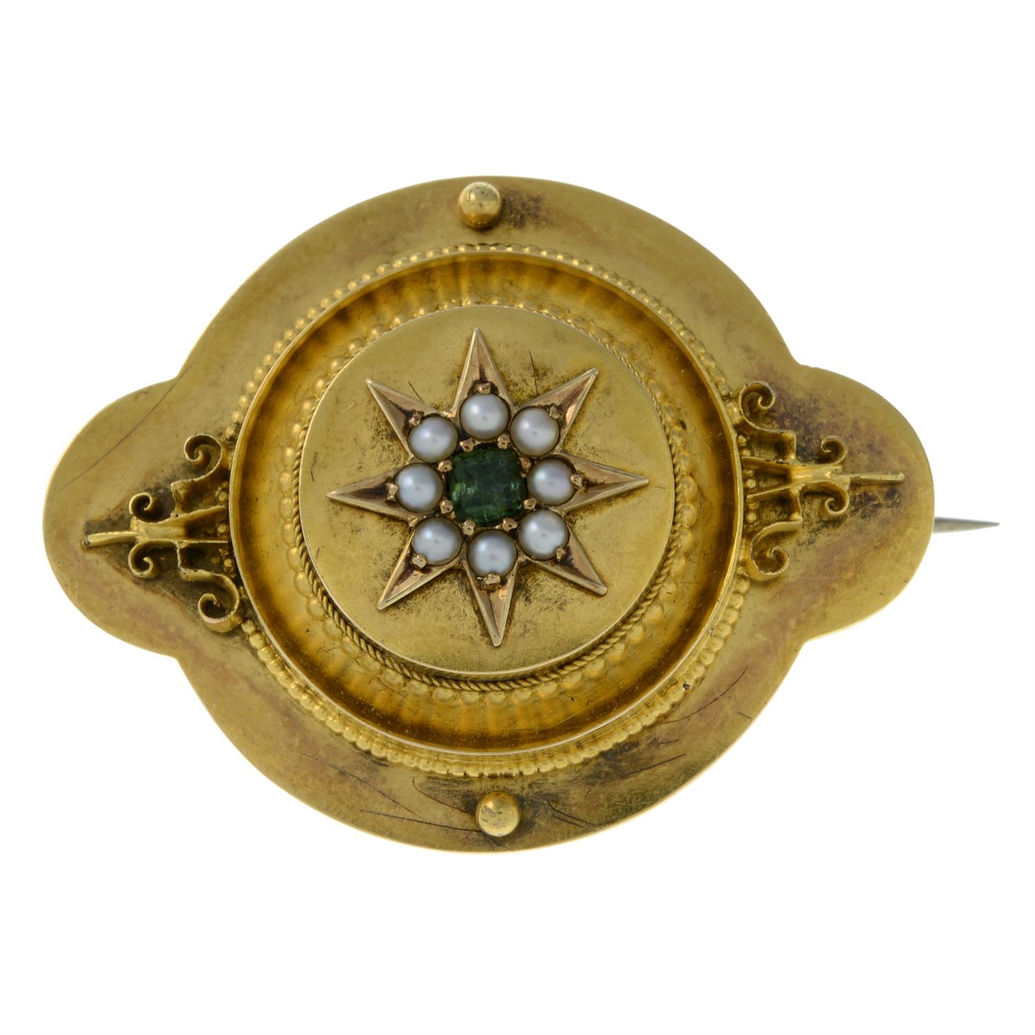 A late 19th century gold split pearl and emerald brooch.