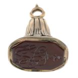 A Georgian gold engraved carnelian seal.