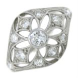 A 1930's platinum diamond dress ring with openwork detail.