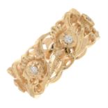 A 14ct gold diamond band ring of daffodil motif.