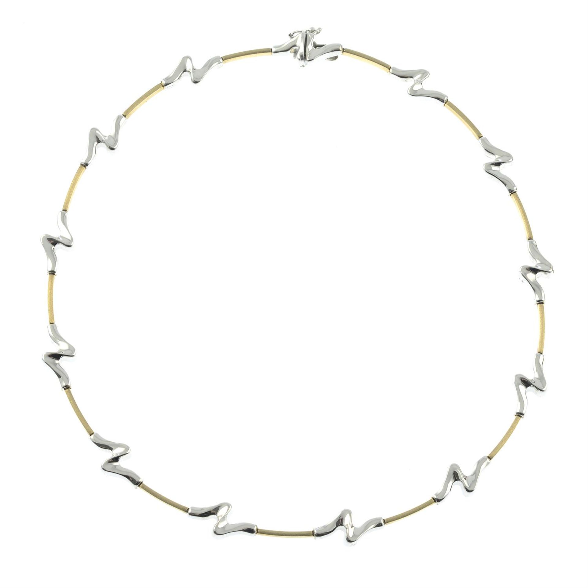 A 9ct bi-colour gold, wave-link necklace, with flat-link spacers.